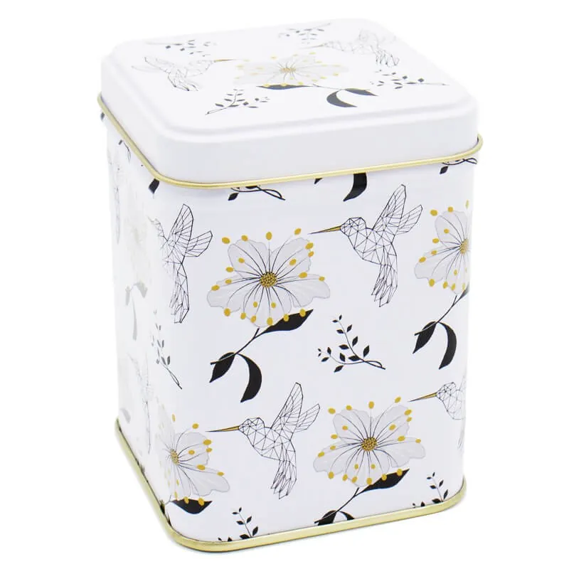 Biała puszka z rysunkami kwiatów i ptaków