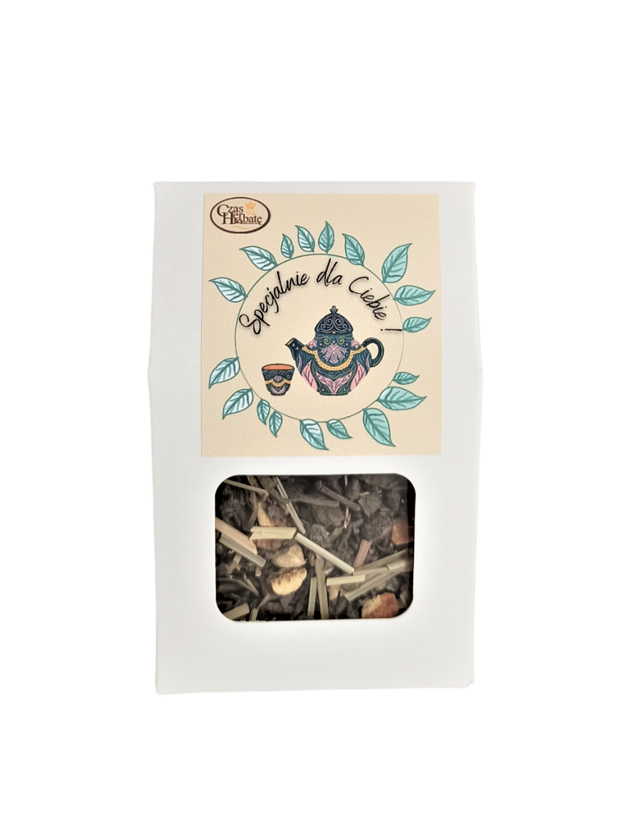 Jasne opakowanie z kwadratowym okienkiem i żółtą etykietą z rysunkiem wianka z liści