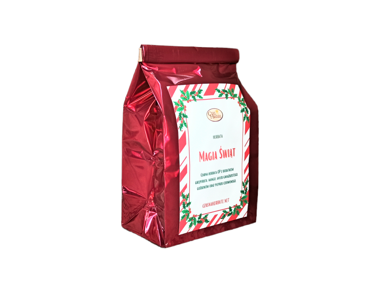 Widok z boku na czerwoną torebkę z napisem "Magia Świąt" – czarna herbata z grejpfrutem, mango, goji i pieprzem czerwonym.