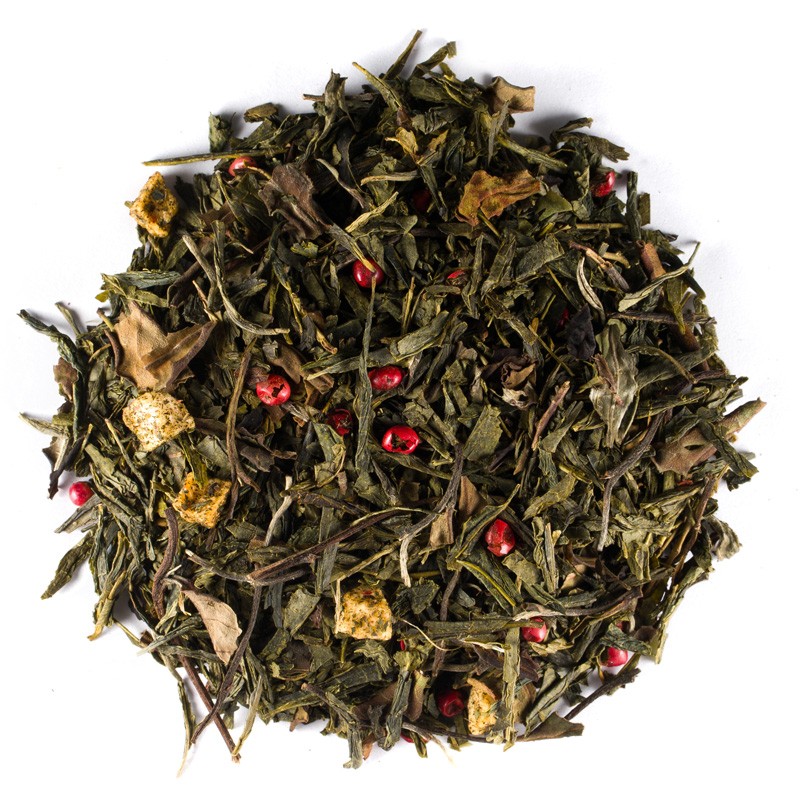 Loose green tea with pieces of citrus fruit, red pepper and leaves on a white background.