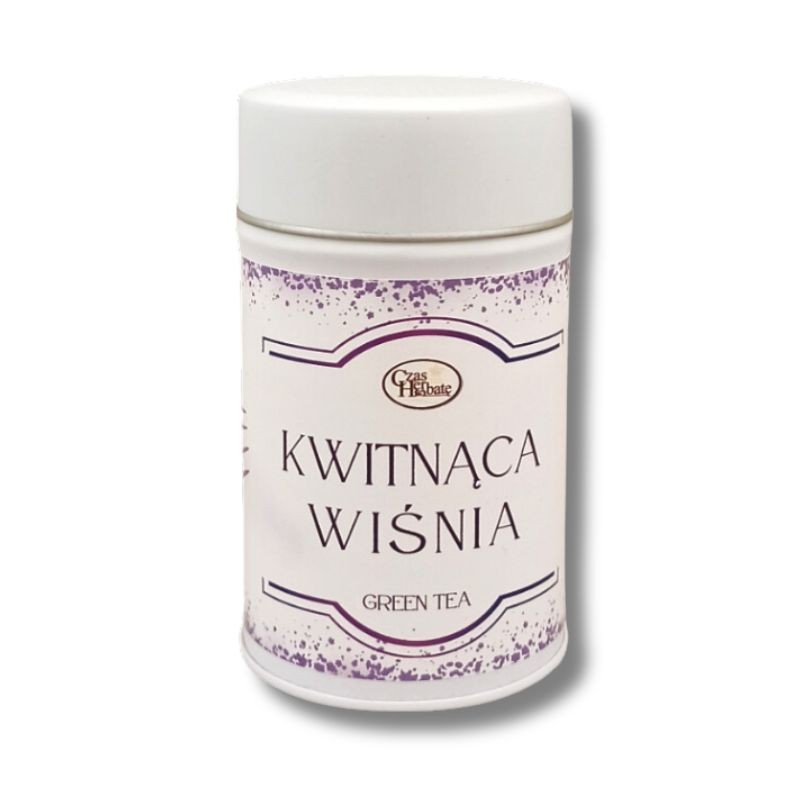 Biała puszka herbaty z napisem "Kwitnąca Wiśnia", dekorowana fioletowymi akcentami i logo "Czas na Herbatę", przeznaczona na zieloną herbatę smakową.