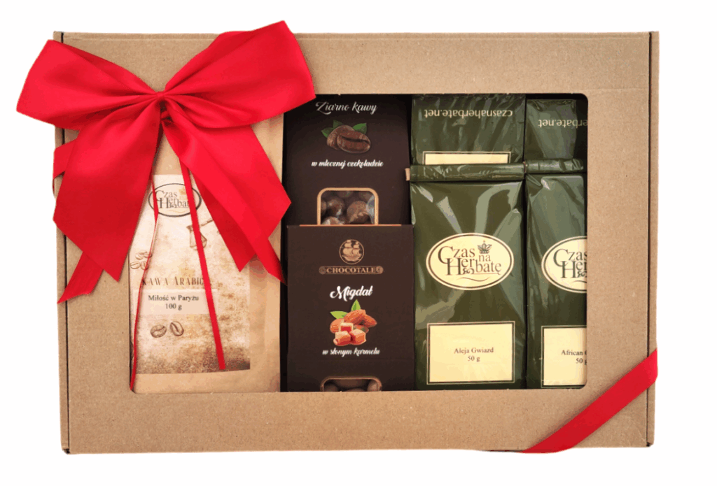 Widok z przodu na zestaw prezentowy w kartonowym pudełku z dużą czerwoną kokardą, zawierający kawę, słodycze i dwie paczki herbaty liściastej.