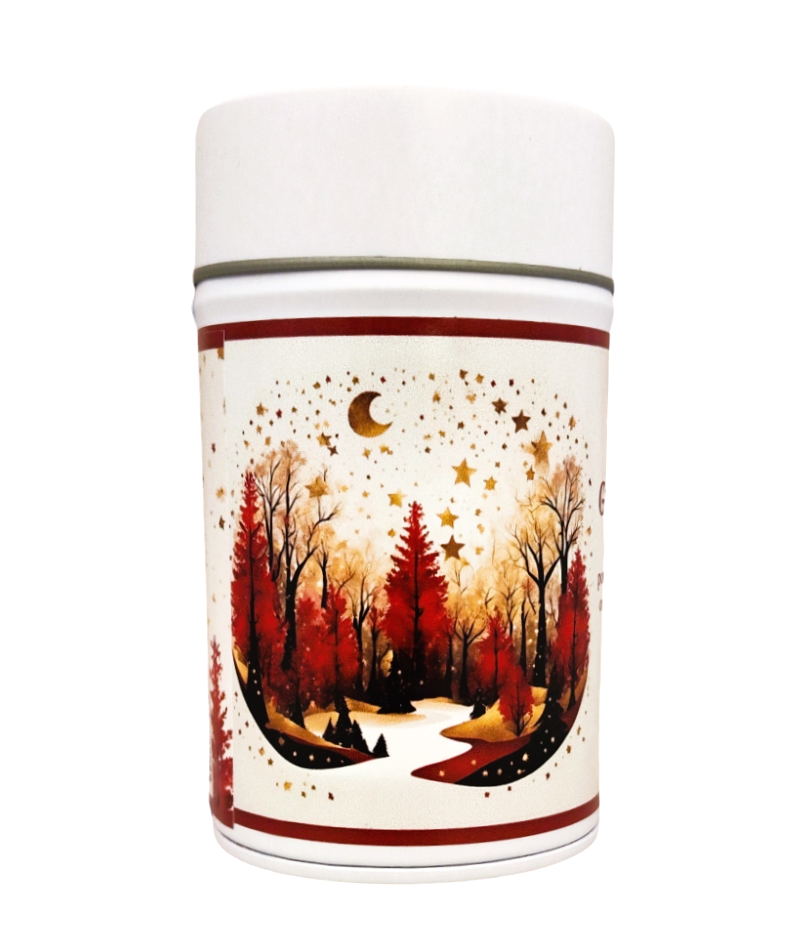 A tea tin decorated with a winter illustration: red trees, a snowy path, golden stars and the moon on a bright background.