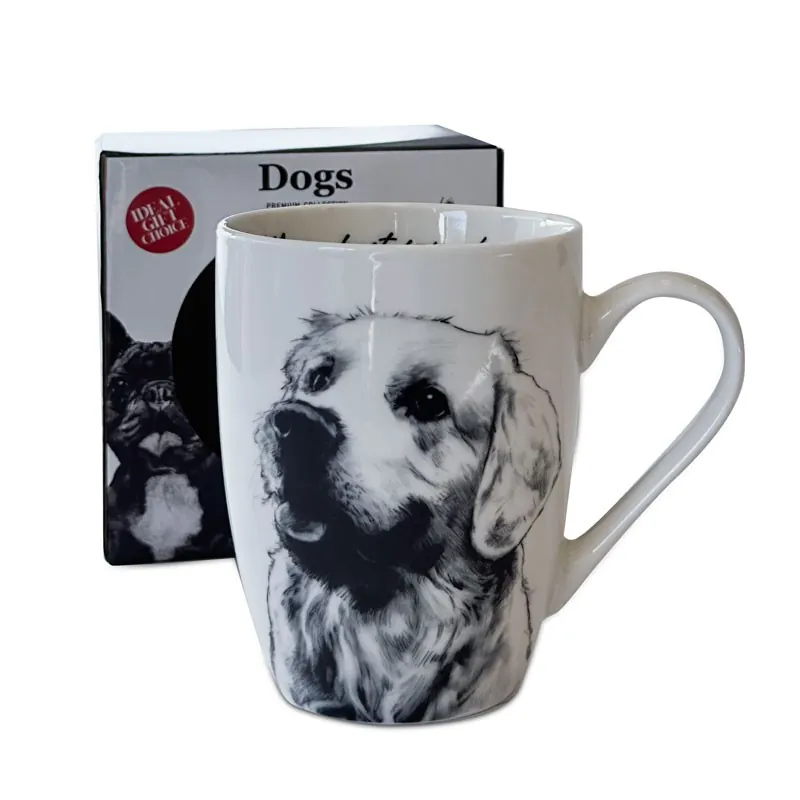 Kubek porcelanowy z czarno-białym rysunkiem psa rasy golden retriever, w tle widoczne dedykowane opakowanie z napisem „Dogs”.